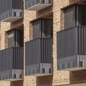Modern brown brick residential buildings with balconies