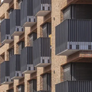 Modern brown brick residential buildings with balconies