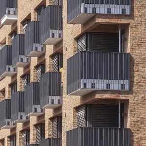 Modern brown brick residential buildings with balconies