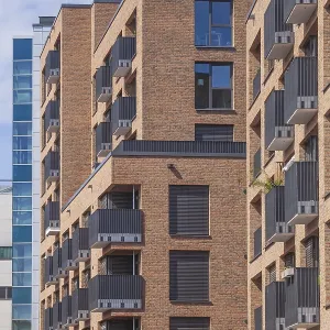 Modern brown brick residential buildings with balconies