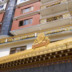 Modern building with traditional Buddhist decorations and balconies Modern building with traditional Buddhist decorations and balconies
