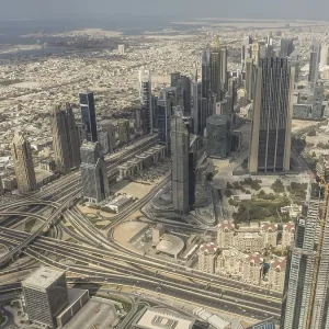 Modern city view with skyscrapers and complex highway network in urban surroundings