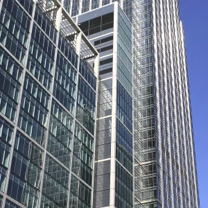 Modern glass skyscraper on a blue sky background