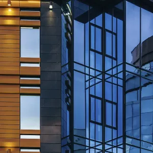 Modern high-rise office building with a glass facade Modern high-rise office building with a glass facade