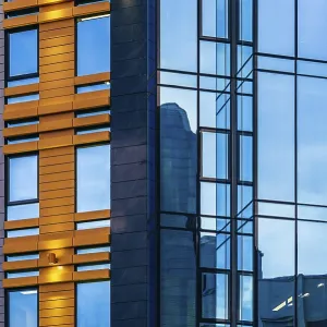 Modern high-rise office building with a glass facade Modern high-rise office building with a glass facade
