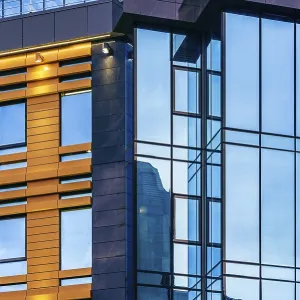 Modern high-rise office building with a glass facade Modern high-rise office building with a glass facade