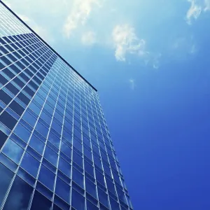 Modern office skyscraper building with blue sky background