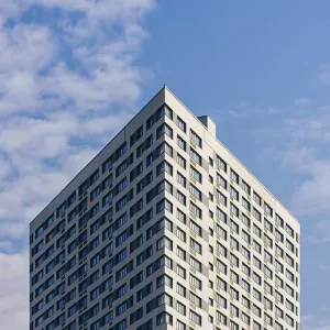 Modern Skyscraper on the Cloudy Sky Background Modern Skyscraper on the Cloudy Sky Background