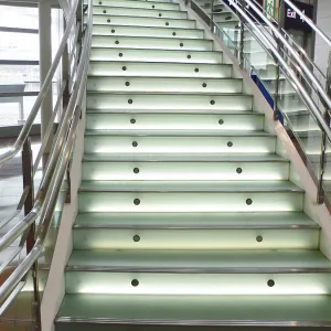 Modern stained and matted glass stairs with metallic hand-rails