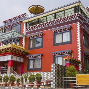 Modern temple with red facade and typical Buddhist architecture Modern temple with red facade and typical Buddhist architecture