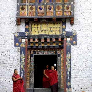 Monks of the Drukpa monastic community entering the courtyard of Trashigang Dzong fortress Monks of the Drukpa monastic community entering the courtyard of Trashigang Dzong fortress
