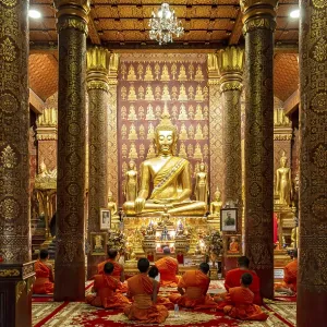 Monks praying at Wat Sensoukaram Monks praying at Wat Sensoukaram