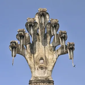 Monumental depiction of Buddha meditating under the protected of a seven-headed Naga serpent