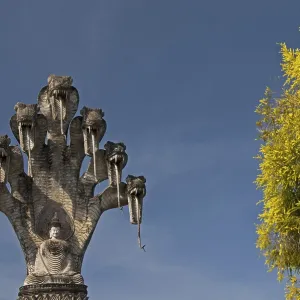 Monumental depiction of Buddha meditating under the protection of a seven-headed naga snake Monumental depiction of Buddha meditating under the protection of a seven-headed naga snake