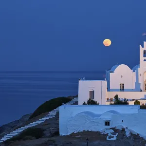 Full moon behind the monastery Chrisopigi on Sifnos