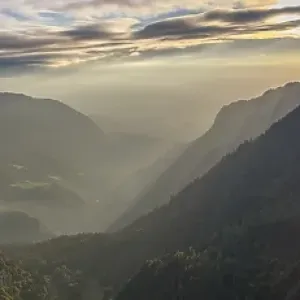 Morning atmosphere over the Val de Travers from the edge of the rocky basin at the Creux du Van, Canton Neuchatel, Switzerland, Europe Morning atmosphere over the Val de Travers from the edge of the rocky basin at the Creux du Van, Canton Neuchatel, Switzerland, Europe