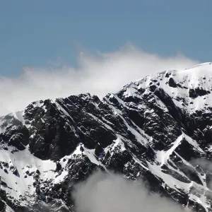Morning cloud gathers around the alpine peaks of the Southern Alps