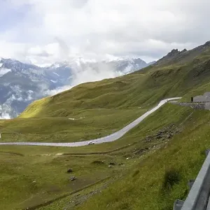 Morning fog drifts over a mountain ridge