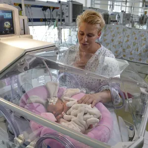 Mother of Twins with Newborn in Incubator Print