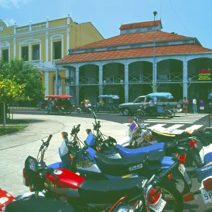Motorbikes, iron house built by Gustav Eiffel in the center of Iquitos on the Amazon Motorbikes, iron house built by Gustav Eiffel in the center of Iquitos on the Amazon