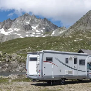 Motorhome in alpine landscape near Nufenen Pass