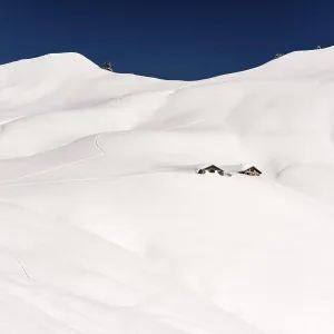 Mountain chalet in snow-covered landscape Mountain chalet in snow-covered landscape