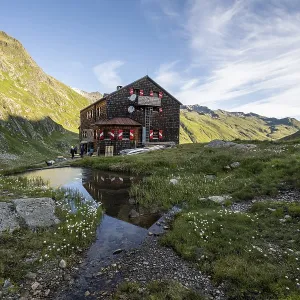 Mountain hut Elberfelderhutte with small lake and cotton grass