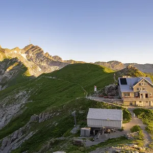 Mountain hut on the Rotstein Pass with a view of the Lisengrat and the summit of the Santis