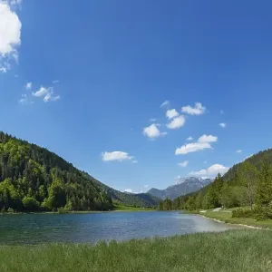 Mountain lake, hiking trail around the lake Mountain lake, hiking trail around the lake