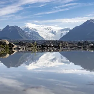 Mountain landscape reflected in glacial lake