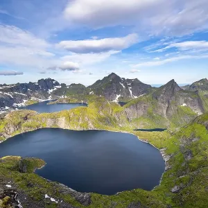 Mountain landscape with steep rocky peaks and lake Tennesvatnet and Krokvatnet Mountain landscape with steep rocky peaks and lake Tennesvatnet and Krokvatnet