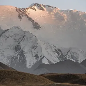 Mountain landscape at sunset, summit of Pik Lenin with glacier
