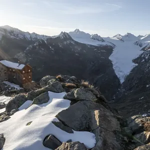 Mountain panorama and glacier, mountain hut Ramolhaus in autumn with snow