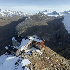 Mountain panorama and glacier, mountain hut Ramolhaus in autumn with snow