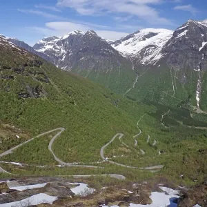 Mountain pass in Zig Zag, spring-like landscape with snowfields