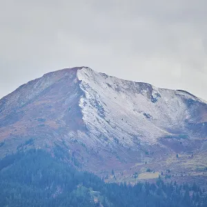 Mountain peak covered with snow in fall Mountain peak covered with snow in fall