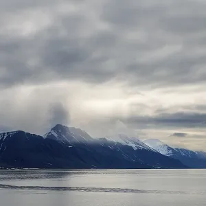 Mountain range in the fog, sea