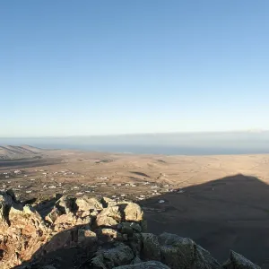 Mountain shadow in the shape of a triangle in the landscape