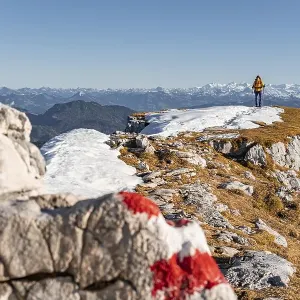 Mountaineer looks over snow-covered mountains Mountaineer looks over snow-covered mountains