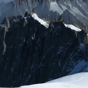 Two Mountaineers on Snow in the Mountains in French Alps Two Mountaineers on Snow in the Mountains in French Alps