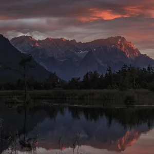 Mountains reflected in lake, sunset Mountains reflected in lake, sunset