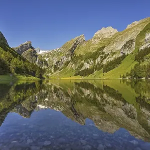 Mountains are reflected in the Seealpsee Mountains are reflected in the Seealpsee