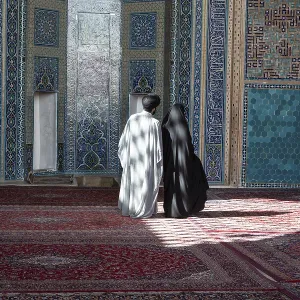 Muslim couple in the Jameh Mosque, Yazd, Iran