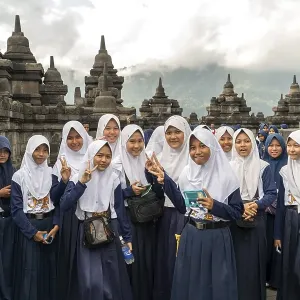 Muslim schoolgirl in uniform with headscarf