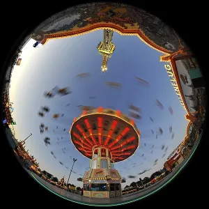 Night scene, fisheye shot, Chair-O-Planes or swing carousel Night scene, fisheye shot, Chair-O-Planes or swing carousel