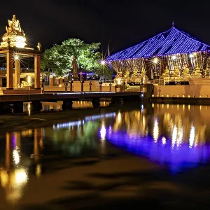 Night scene of an illuminated temple whose lights are reflected in the water Night scene of an illuminated temple whose lights are reflected in the water