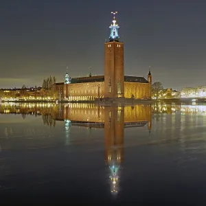 Night scene of a town hall with illuminated tower