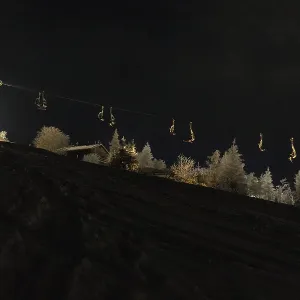Night shot of the ski lift on the ski slope in Eibenstock