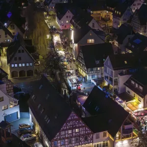 Night view of a village with illuminated half-timbered houses and roads Night view of a village with illuminated half-timbered houses and roads