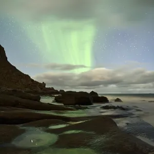 Northern Lights, Aurora Borealis above the beach of Utakleiv Northern Lights, Aurora Borealis above the beach of Utakleiv